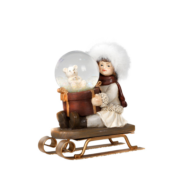 Schlittenmädchen mit Schneekugel